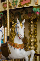 City colorful traditional french carousel for children, horse for riding