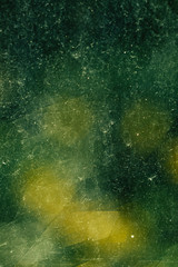 Fototapeta premium beautiful close up macro of dirty stained green glass
