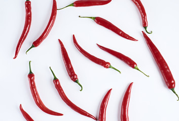Flat lay red chili peppers pattern on white background. Top view
