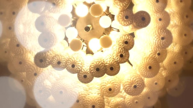 Chandeliers spiral to soft light yellow like a dream.
Bokeh is shining brightly out.
