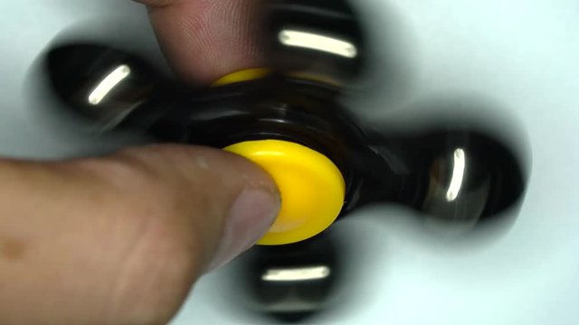 Spinner rotation on fingers at high speed.