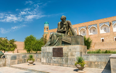 Fototapeta na wymiar Statue of Al-Khwarizmi in front of Itchan Kala in Khiva, Uzbekistan