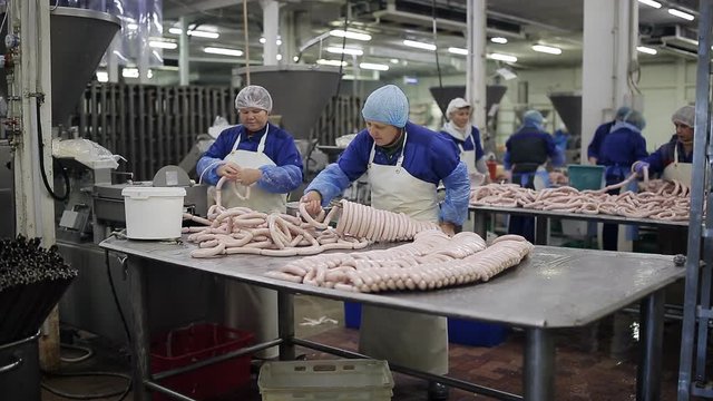 Production of sausages in the meat industry. production of sausages in a meat shop. meat preparations - healthy food. raw sausage