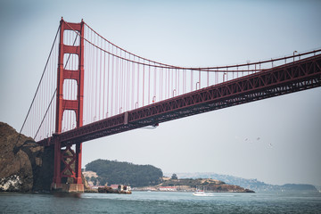 Fototapeta na wymiar Golden Gate Bridge in San Francisco on a hazy summer day with no clouds