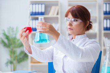 Female scientist researcher conducting an experiment in a labora