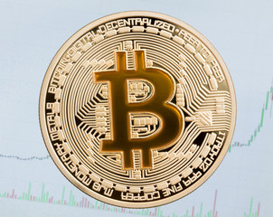 Golden cruptocurrency coin yellow bitcoin on blue background.
