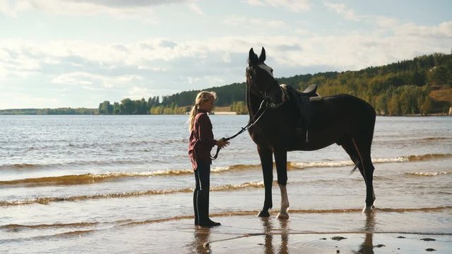 girl to take care of the horses on the beach