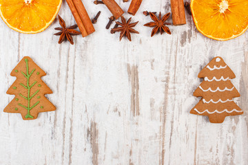 Fresh baked gingerbread with spices on old rustic board, Christmas time concept