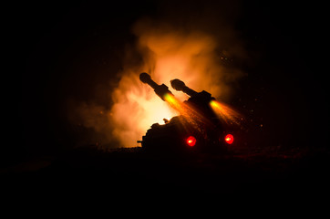 Rocket launch with fire clouds. Battle scene with rocket Missiles with Warhead Aimed at Gloomy Sky at night. Rocket vehicle on War Backgound.