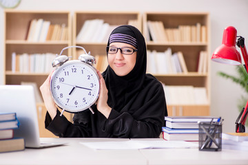 Muslim girl in hijab studying preparing for exams