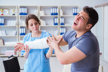 Doctor and patient during check-up for injury in hospital