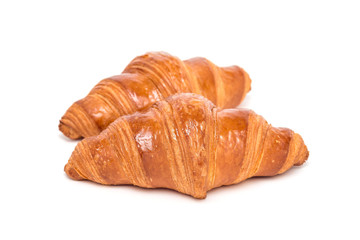 Two fresh croissant isolated on white background,