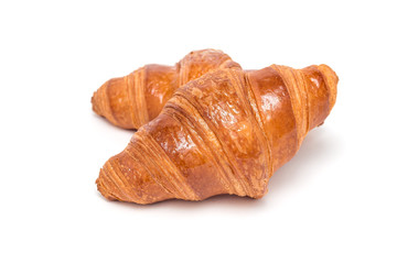 Two fresh croissant isolated on white background,