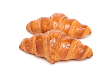 Two fresh croissant isolated on white background,