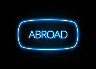 Abroad  - colorful Neon Sign on brickwall