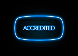 Accredited  - colorful Neon Sign on brickwall