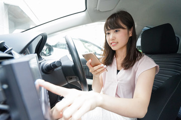 Woman using car navigation