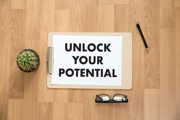 UNLOCK YOUR POTENTIAL  businessman hand working concept for GROWTH