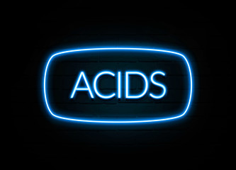 Acids  - colorful Neon Sign on brickwall