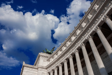 Fototapeta premium Vittoriano (Altar of Nation) monumental colonnade with beautiful sky in Rome