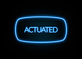 Actuated  - colorful Neon Sign on brickwall