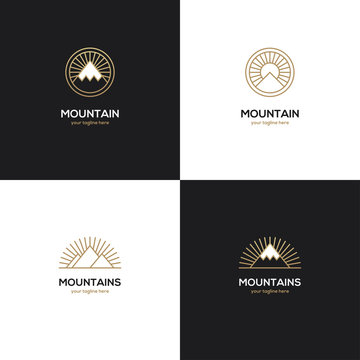 Four mountain logo in golden color.