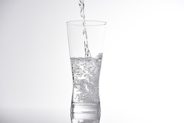 pouring water into glass