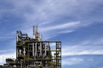 Oil refinery plant with blue sky .