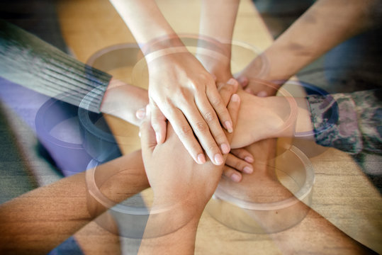 Double exposure of  Group of Diverse Hands Together Joining with metal loop Connection background .Teamwork concept.