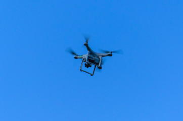 White drone in blue sky
