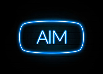 Aim  - colorful Neon Sign on brickwall