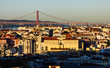 Beautiful cityscape of Lisbon with the Tagus river, the 25th of April bridge and historic buildings viewed from Miradouro Sophia de Mello