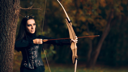 Female Archer Warrior in Costume with Bow and Arrow