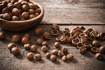 Hazelnuts on wooden background