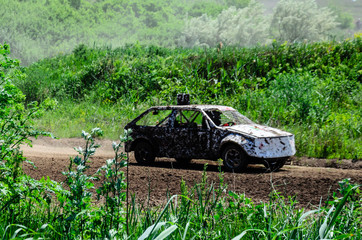 Race of the old wrecked cars. Rally on the open air with dust