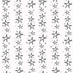 Seamless pattern with black stars on a white background.