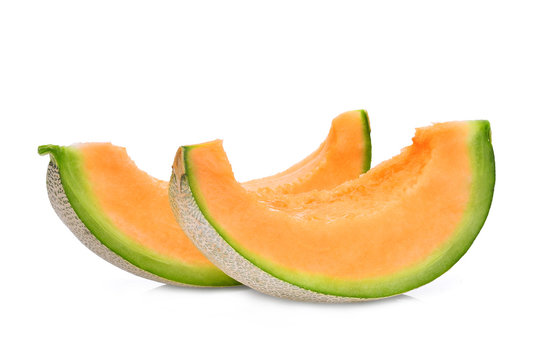 two slice of japanese melons, green melon or cantaloupe melon with seeds isolated on white background