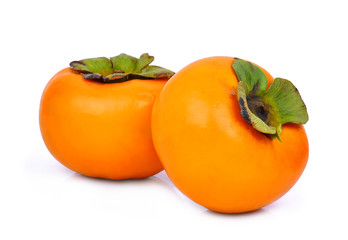 two whole of fresh ripe persimmons isolated on white background