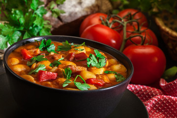 White bean soup with potatoes, tomatoes, paprika, and bacon