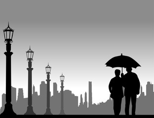 Lovely retired elderly couple walking under the umbrella on the street in autumn or fall, one in the series of similar images silhouette