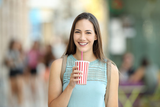 Front Portrait Of A Girl Holding A Take Away Drink