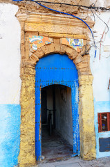 Traditional Moroccan blue door in medina