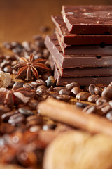 Aroma coffee chocolate cookies and spices on the wooden table. Dark wooden background. Top view. Close. Closeup.