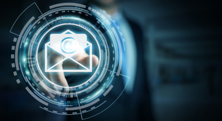 Businessman touching 3D rendering flying email icon with his finger