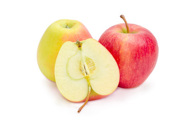 Two whole and halve of the red and yellow apples