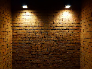 abstract old brick wall in the dark with two spotlight, warm light tone. brick wall in empty room. brick wall background for wallpaper