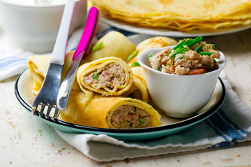 Blinis with force meat. selective focus