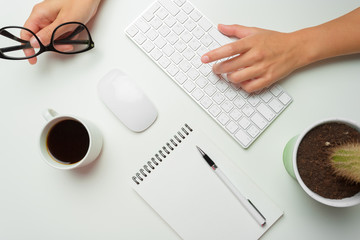 women's hands using keyboard and mouse