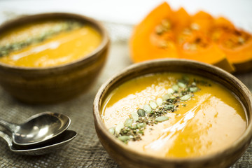 traditional autumn dish for Thanksgiving - pumpkin soup with garlic.