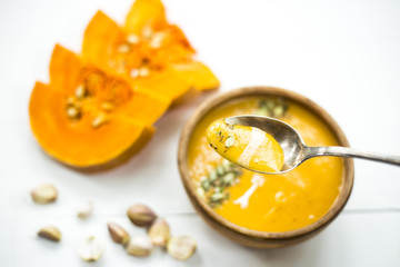 traditional autumn dish for Thanksgiving - pumpkin soup with garlic.